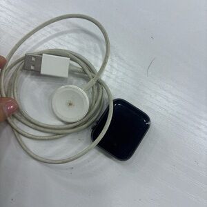 Apple Black Smartwatch with White Charger